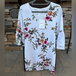 Women’s floral dress long sleeve by Belongsci in size small. New with tags.